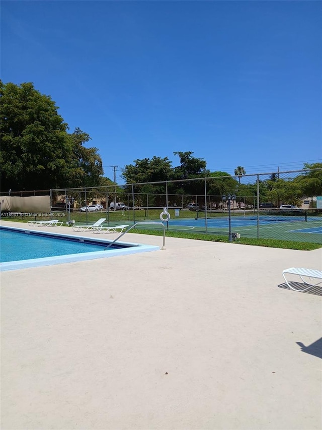450 NW 46th St Unit 450, Deerfield Beach, FL 33064 - community pool with a tennis court