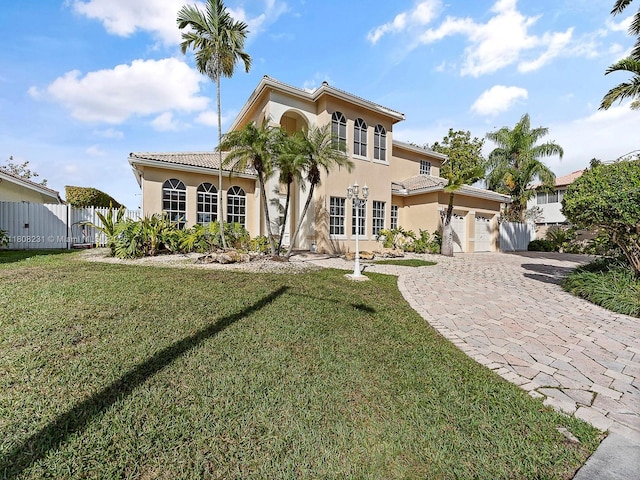 11230 SW 156th Ave, Miami, FL 33196 - mediterranean / spanish-style home with a garage, decorative driveway, stucco siding, and a gate