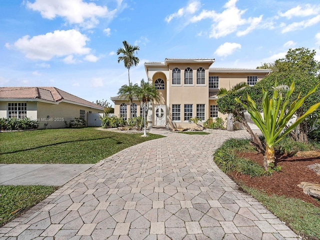 11230 SW 156th Ave, Miami, FL 33196 - mediterranean / spanish house with curved driveway, a front yard, and stucco siding