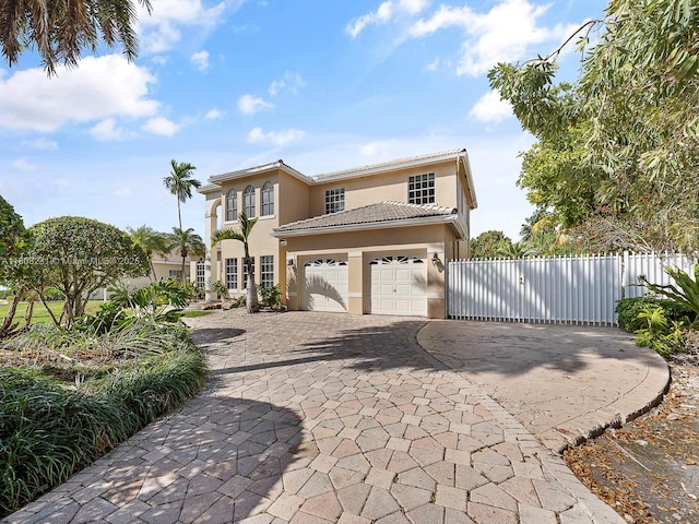 11230 SW 156th Ave, Miami, FL 33196 - view of front of property featuring stucco siding, decorative driveway, a tiled roof, and an attached garage