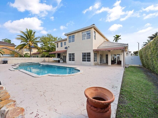 11230 SW 156th Ave, Miami, FL 33196 - view of swimming pool with a patio area, a fenced backyard, and a pool with connected hot tub