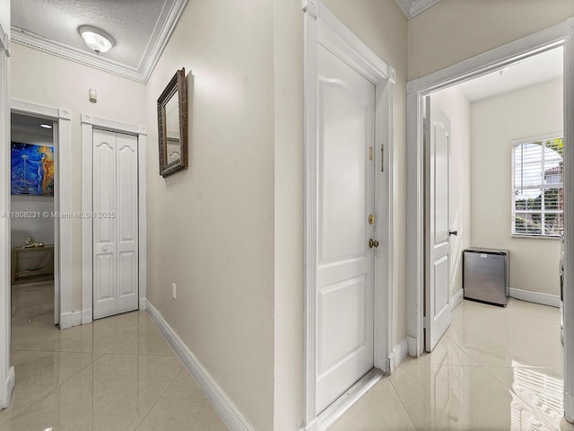 11230 SW 156th Ave, Miami, FL 33196 - hall featuring ornamental molding, baseboards, light tile patterned floors, and a textured ceiling