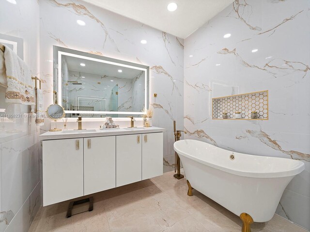 11230 SW 156th Ave, Miami, FL 33196 - full bath featuring double vanity, stone wall, a freestanding bath, a marble finish shower, and marble tiled floors