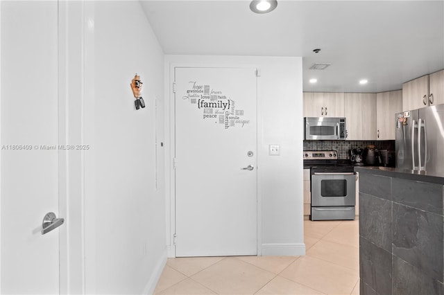 1401 SW 22nd St Unit 701, Miami, FL 33145 - kitchen featuring stainless steel appliances, light tile patterned flooring, tasteful backsplash, light brown cabinetry, and recessed lighting