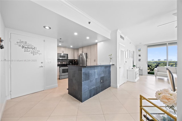 1401 SW 22nd St Unit 701, Miami, FL 33145 - kitchen with stainless steel appliances, dark countertops, decorative backsplash, light tile patterned floors, and crown molding