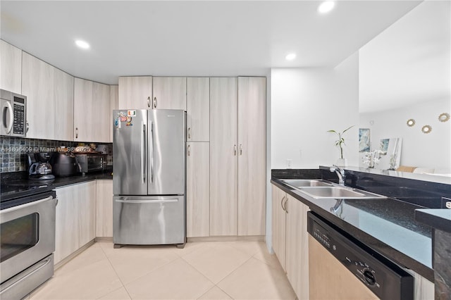 1401 SW 22nd St Unit 701, Miami, FL 33145 - kitchen with appliances with stainless steel finishes, a sink, light tile patterned floors, light brown cabinets, and recessed lighting