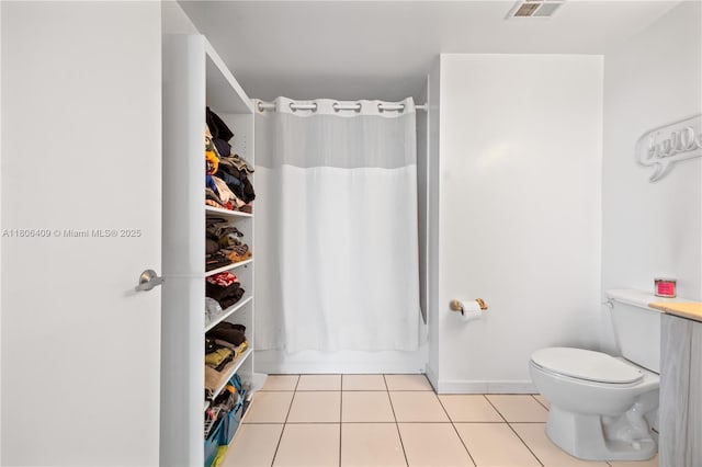 1401 SW 22nd St Unit 701, Miami, FL 33145 - full bathroom with shower / bathtub combination with curtain, toilet, and tile patterned floors