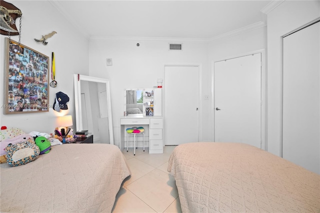 1401 SW 22nd St Unit 701, Miami, FL 33145 - bedroom with crown molding and light tile patterned floors