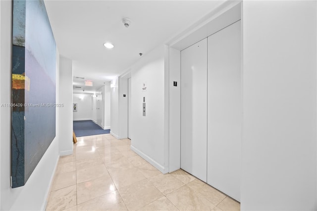 1401 SW 22nd St Unit 701, Miami, FL 33145 - hall with elevator, light tile patterned floors, baseboards, and recessed lighting