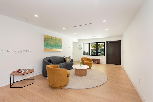 8959 Abbott Ave, Surfside, FL 33154 - living area with light wood-style flooring, recessed lighting, and baseboards