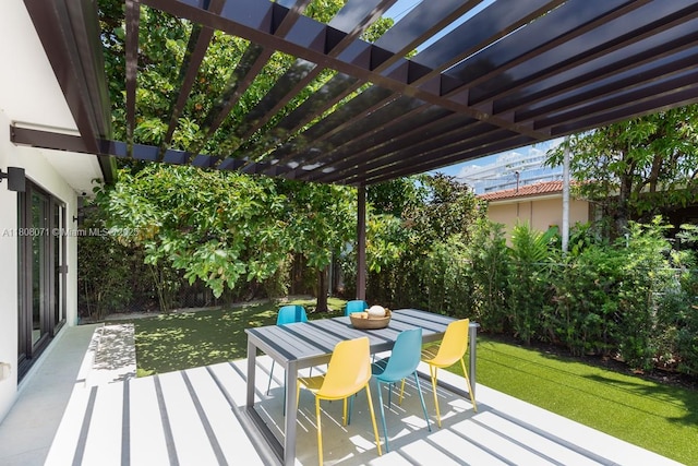 8959 Abbott Ave, Surfside, FL 33154 - wooden deck with a pergola, outdoor dining area, and a yard