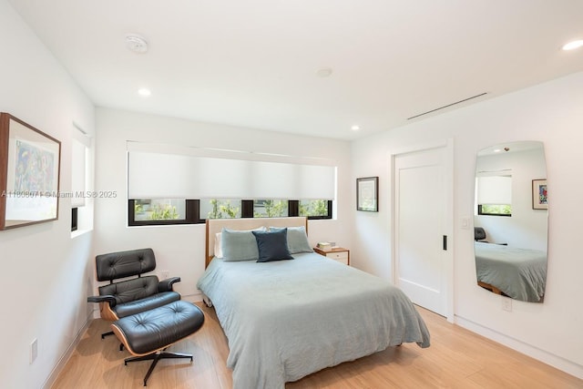8959 Abbott Ave, Surfside, FL 33154 - bedroom with light wood finished floors, recessed lighting, and baseboards