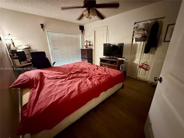 21468 SW 88th Ave, Cutler Bay, FL 33189 - bedroom featuring a textured ceiling, wood finished floors, and a ceiling fan