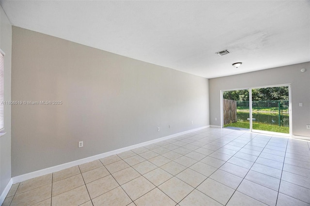1880 SE 3rd Dr, Homestead, FL 33033 - spare room with light tile patterned floors and baseboards