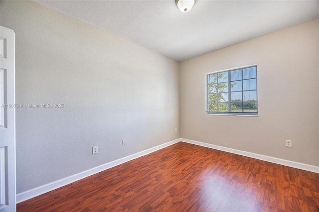 1880 SE 3rd Dr, Homestead, FL 33033 - empty room with baseboards and wood finished floors