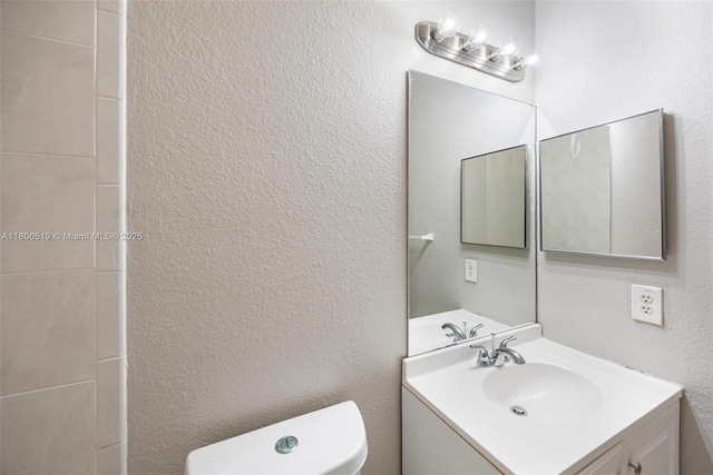 1880 SE 3rd Dr, Homestead, FL 33033 - bathroom with toilet, vanity, and a textured wall