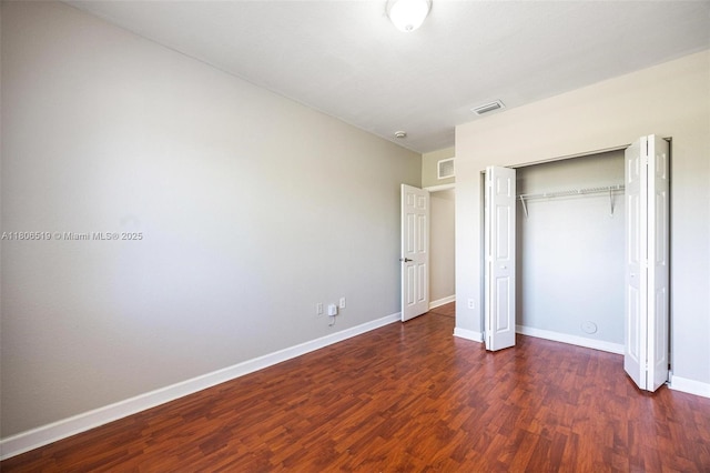1880 SE 3rd Dr, Homestead, FL 33033 - unfurnished bedroom with wood finished floors, a closet, and baseboards