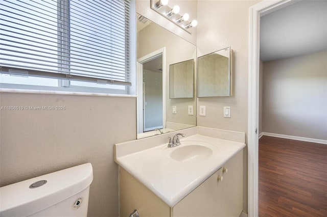 1880 SE 3rd Dr, Homestead, FL 33033 - bathroom featuring vanity, toilet, wood finished floors, and baseboards