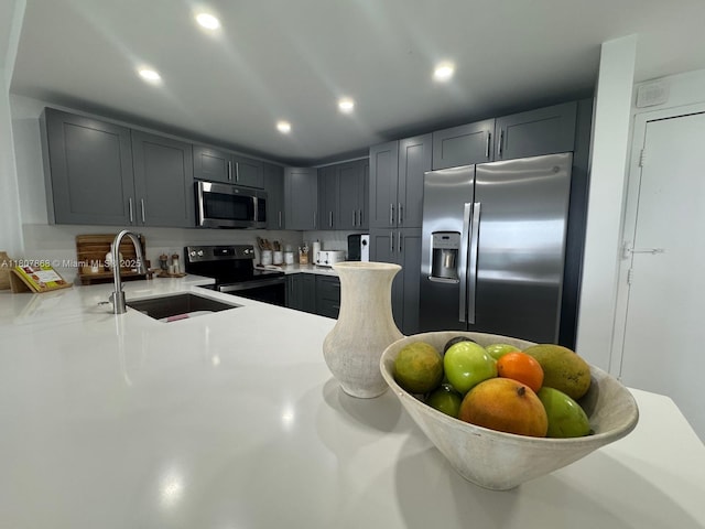 3800 S Ocean Dr Unit 1810, Hollywood, FL 33019 - kitchen with appliances with stainless steel finishes, a sink, light countertops, gray cabinetry, and recessed lighting