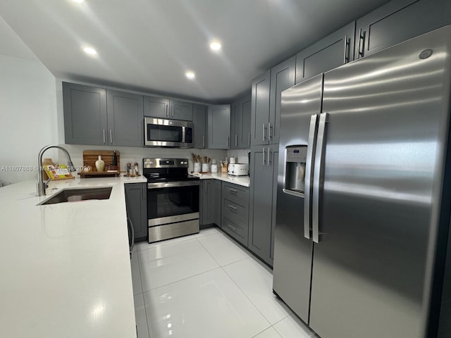 3800 S Ocean Dr Unit 1810, Hollywood, FL 33019 - kitchen with stainless steel appliances, a sink, gray cabinets, light countertops, and recessed lighting