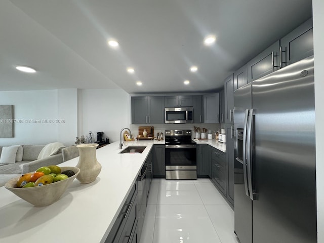 3800 S Ocean Dr Unit 1810, Hollywood, FL 33019 - kitchen with appliances with stainless steel finishes, a sink, gray cabinetry, open floor plan, and light tile patterned floors