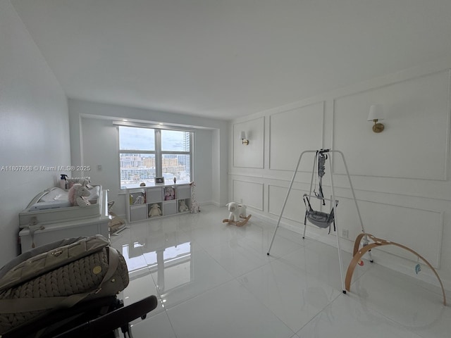 3800 S Ocean Dr Unit 1810, Hollywood, FL 33019 - living area with a decorative wall and baseboards