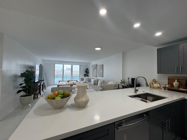 3800 S Ocean Dr Unit 1810, Hollywood, FL 33019 - kitchen featuring dishwasher, a sink, open floor plan, light countertops, and a peninsula