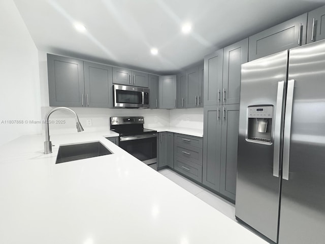 3800 S Ocean Dr Unit 1810, Hollywood, FL 33019 - kitchen with stainless steel appliances, a sink, light countertops, gray cabinets, and recessed lighting