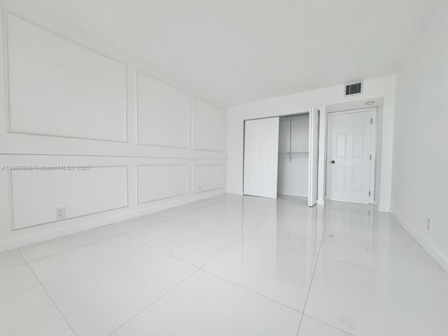 3800 S Ocean Dr Unit 1810, Hollywood, FL 33019 - unfurnished bedroom featuring tile patterned flooring, baseboards, and a closet