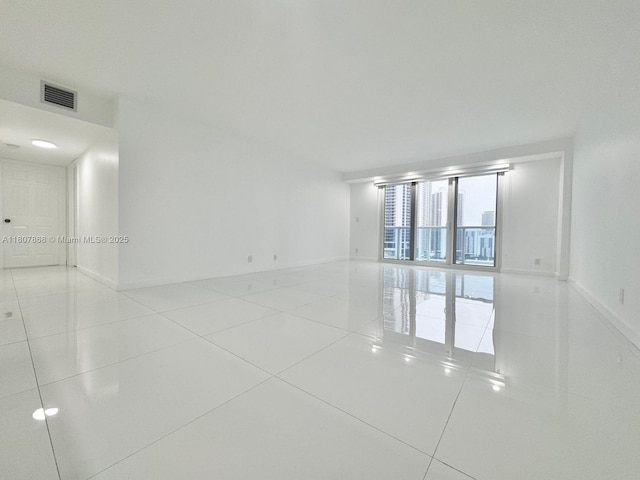 3800 S Ocean Dr Unit 1810, Hollywood, FL 33019 - tiled spare room with baseboards