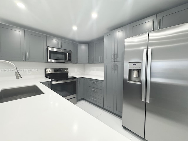 3800 S Ocean Dr Unit 1810, Hollywood, FL 33019 - kitchen featuring appliances with stainless steel finishes, a sink, light countertops, gray cabinets, and recessed lighting