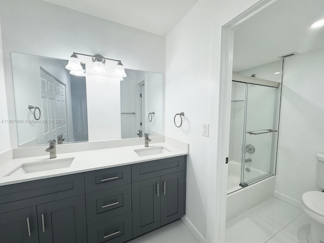 3800 S Ocean Dr Unit 1810, Hollywood, FL 33019 - full bathroom with toilet, baseboards, double vanity, shower / bath combination with glass door, and tile patterned flooring