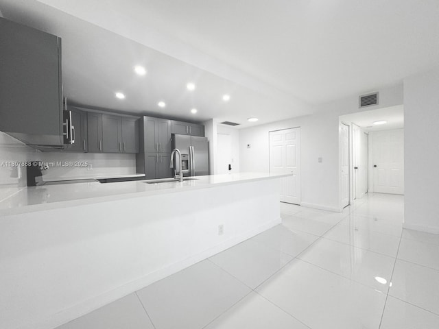 3800 S Ocean Dr Unit 1810, Hollywood, FL 33019 - kitchen with a sink, stainless steel fridge with ice dispenser, recessed lighting, light countertops, and stove