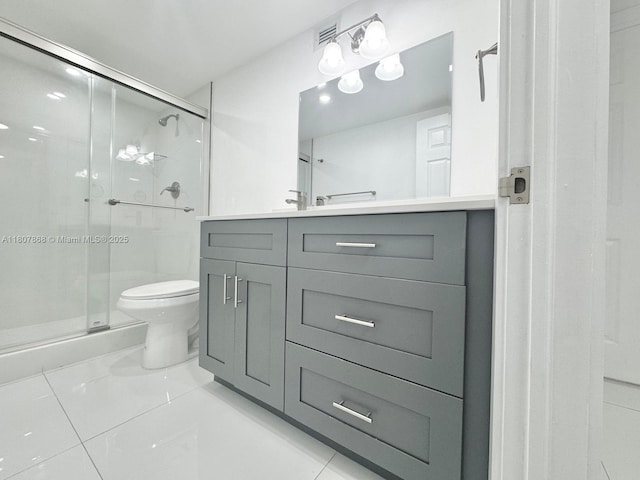 3800 S Ocean Dr Unit 1810, Hollywood, FL 33019 - bathroom featuring toilet, vanity, a shower stall, and tile patterned floors