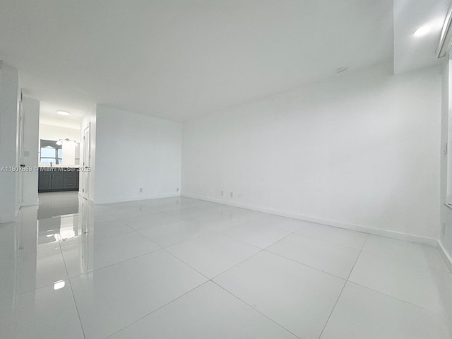 3800 S Ocean Dr Unit 1810, Hollywood, FL 33019 - spare room with baseboards and light tile patterned floors