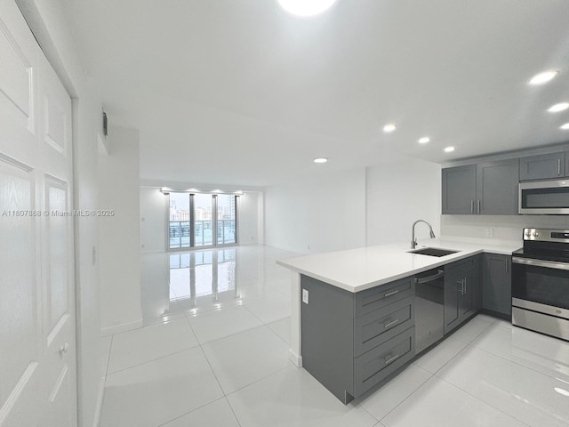 3800 S Ocean Dr Unit 1810, Hollywood, FL 33019 - kitchen featuring appliances with stainless steel finishes, gray cabinetry, a sink, recessed lighting, and light tile patterned floors