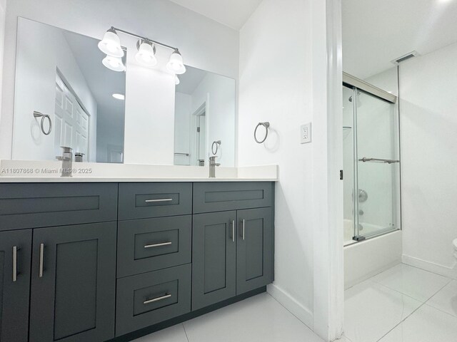 3800 S Ocean Dr Unit 1810, Hollywood, FL 33019 - bathroom featuring baseboards, double vanity, enclosed tub / shower combo, and toilet
