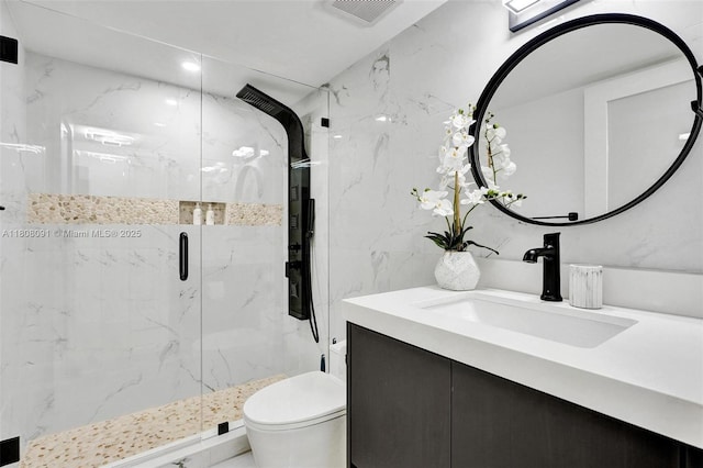 2751 S Ocean Dr Unit 301S, Hollywood, FL 33019 - bathroom with vanity, a marble finish shower, toilet, and tile walls