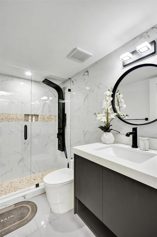 2751 S Ocean Dr Unit 301S, Hollywood, FL 33019 - bathroom with marble finish flooring, toilet, vanity, and a marble finish shower