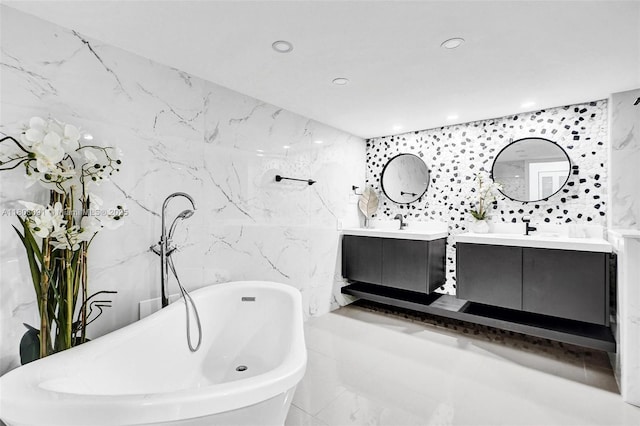 2751 S Ocean Dr Unit 301S, Hollywood, FL 33019 - full bathroom with tile walls, two vanities, a freestanding bath, and recessed lighting