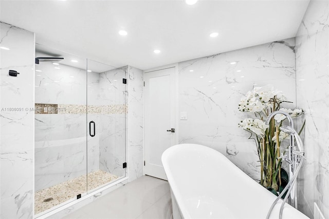 2751 S Ocean Dr Unit 301S, Hollywood, FL 33019 - full bathroom with recessed lighting, a marble finish shower, a freestanding tub, and marble tiled flooring