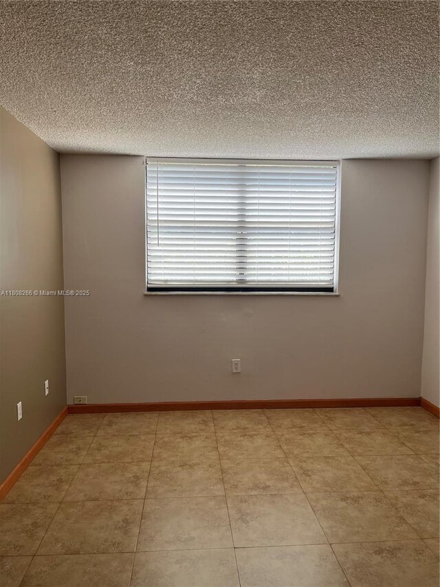 8004 SW 149th Ave Unit C102, Miami, FL 33193 - unfurnished room with a textured ceiling