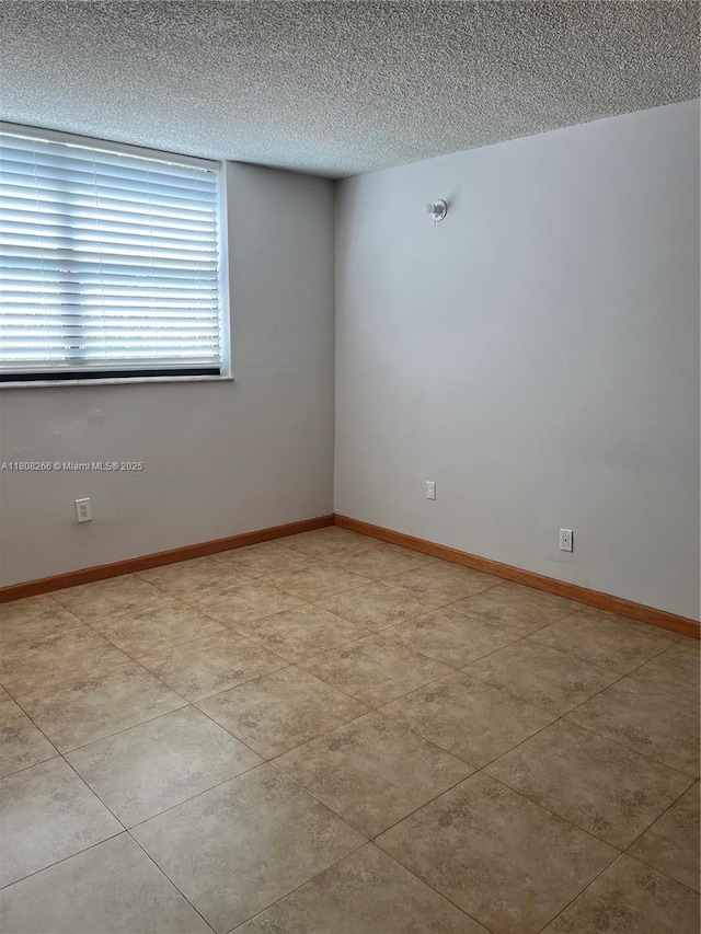 8004 SW 149th Ave Unit C102, Miami, FL 33193 - spare room featuring a textured ceiling
