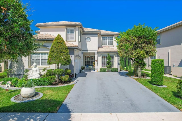4604 SW 132nd Ave, Miramar, FL 33027 - view of front facade with stucco siding, a tile roof, and driveway