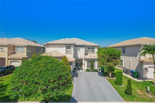 4604 SW 132nd Ave, Miramar, FL 33027 - view of front of property with driveway, stucco siding, a tile roof, and a residential view