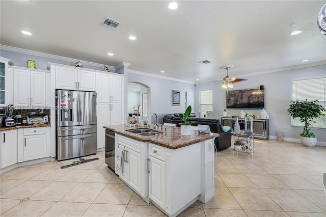 4604 SW 132nd Ave, Miramar, FL 33027 - kitchen with stainless steel refrigerator with ice dispenser, a sink, arched walkways, a ceiling fan, and light tile patterned flooring