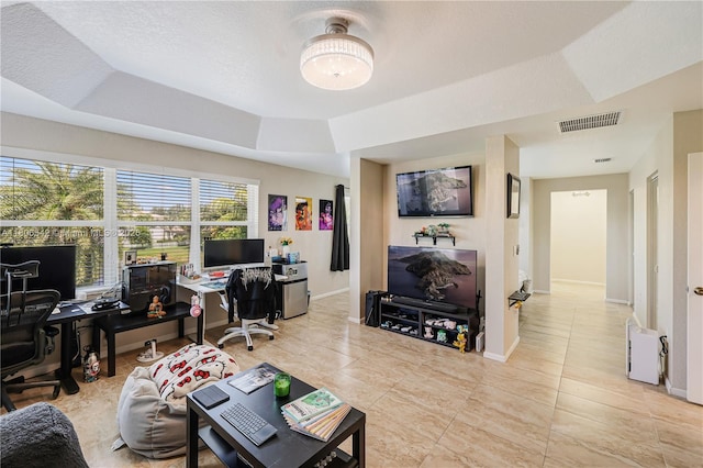 4604 SW 132nd Ave, Miramar, FL 33027 - living room with a desk, baseboards, tile patterned flooring, and a raised ceiling