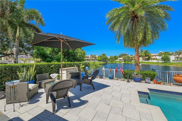 4604 SW 132nd Ave, Miramar, FL 33027 - view of swimming pool featuring a patio, a water view, and an outdoor fire pit