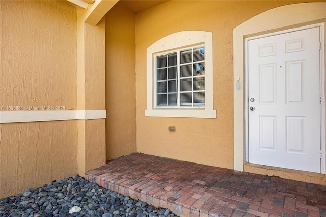 1985 SE 3rd St, Homestead, FL 33033 - doorway to property with stucco siding
