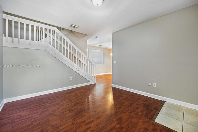 1985 SE 3rd St, Homestead, FL 33033 - unfurnished room with stairs, baseboards, and wood finished floors